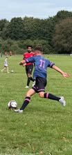 Welsh Warrior F.C. player striking the ball